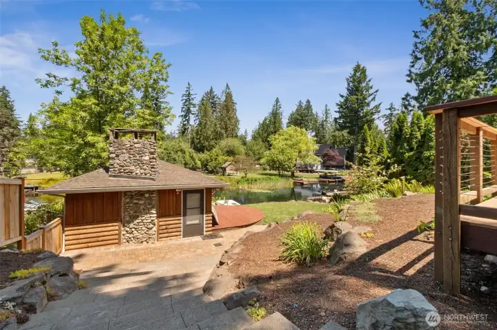 The adorably charming and practical boat house is a highlight of this large property!