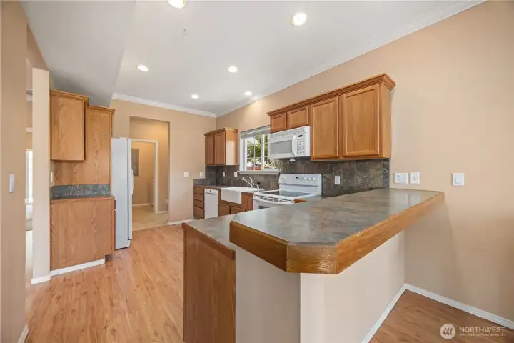 Kitchen with ample storage and eating bar Kitchen with ample storage and eating bar
