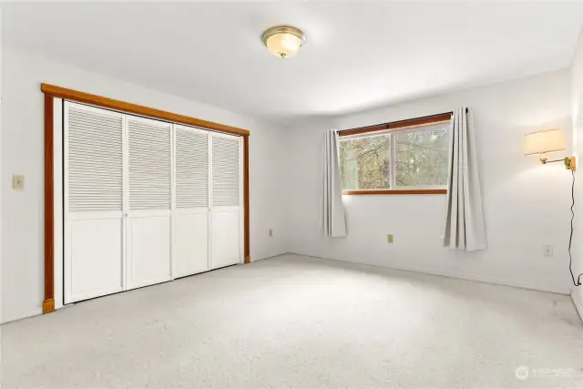 Primary Bedroom on upper level of the home is spacious with large closet and great lighting.