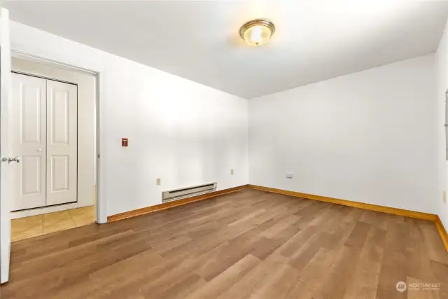 Second Bedroom and Bath on ground level is private and enjoys new vinyl wood floors.  Electric heat. Large double closet.