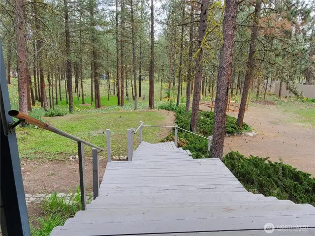 Stairs to front door and decks on North and south sides of the home.