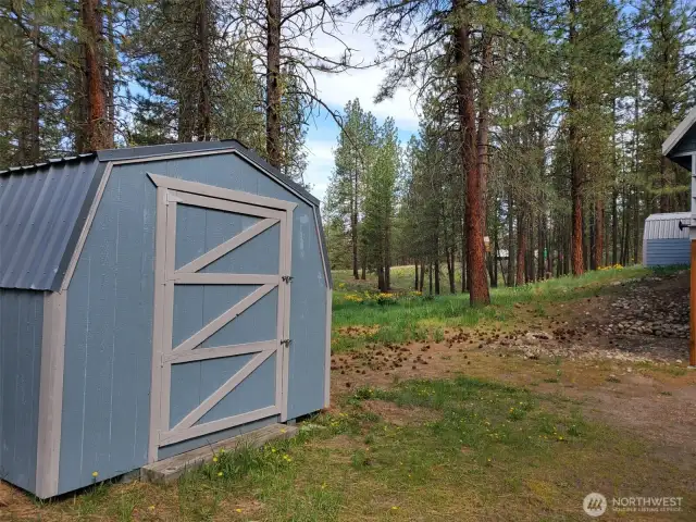 Enjoy extra storage with 2 outbuildings on North and South sides of this home.