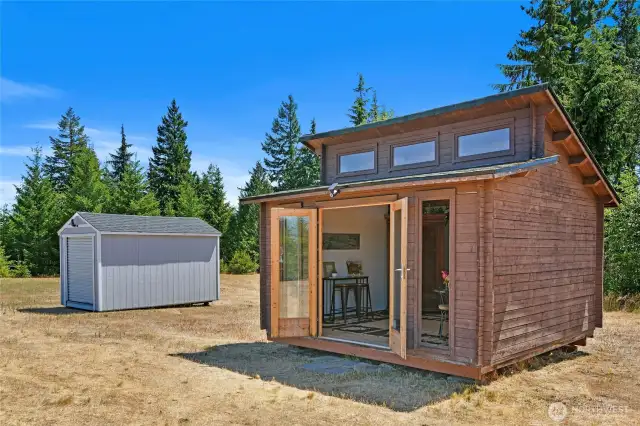2 small outbuildings to enjoy while you build your dream home