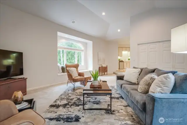 large en-suite bonus room with closets, quartz wet bar area with beverage fridge, window seat with storage and a 3/4 bathroom.