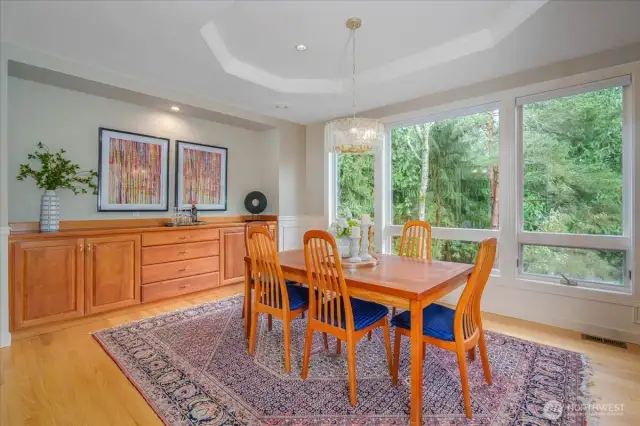 The dining room boasts a built-in buffet and new contemporary chandelier.