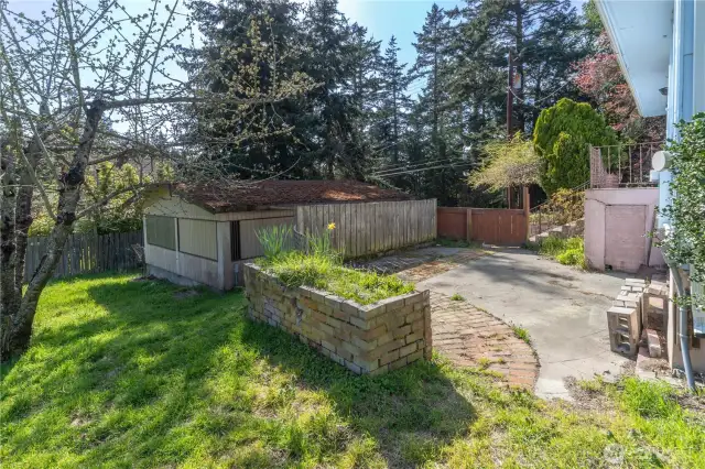 Looking from the top of the lot (house on right) toward the garage on the left.