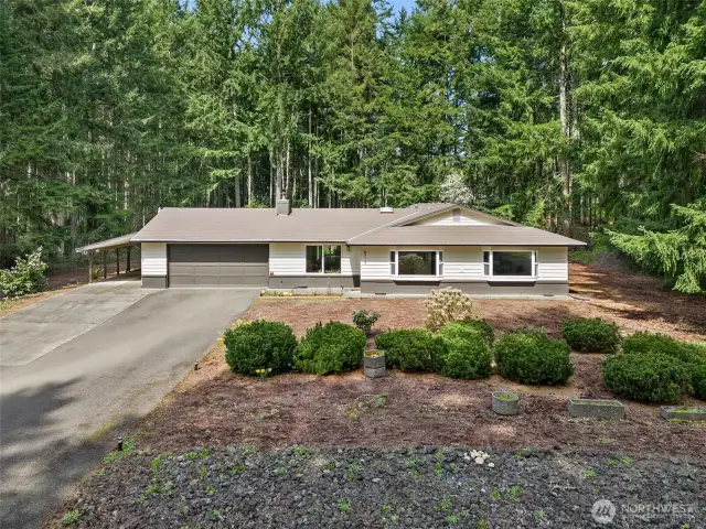 Enjoy a spacious lot with wooded views.