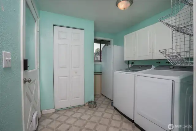 Laundry room with access door to driveway