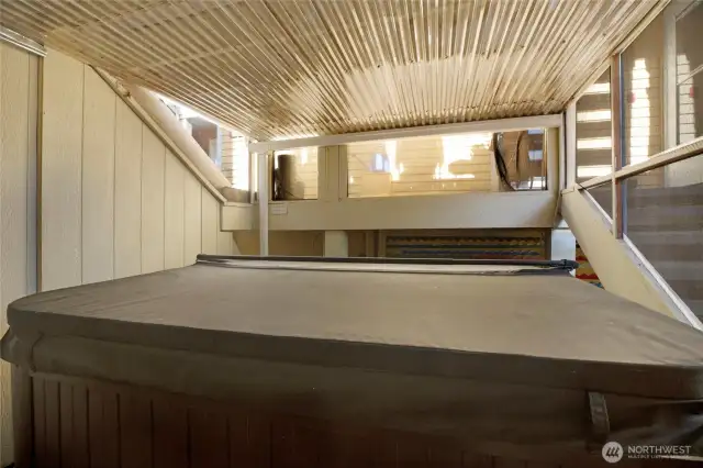 Enjoy soaking in this covered hot tub year round