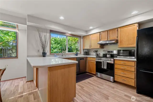 Light and bright kitchen w/newer dishwasher and stove.