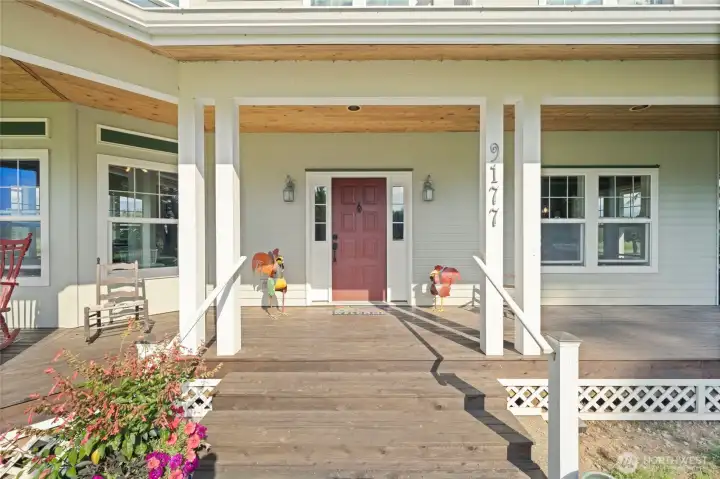 Front door with welcoming wrap around front porch!