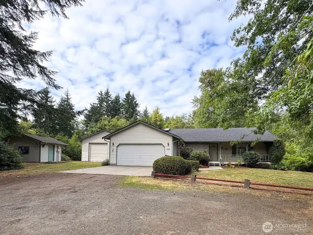 Inviting rambler with attached 2-car garage, extra parking, and easy turn-around space.
