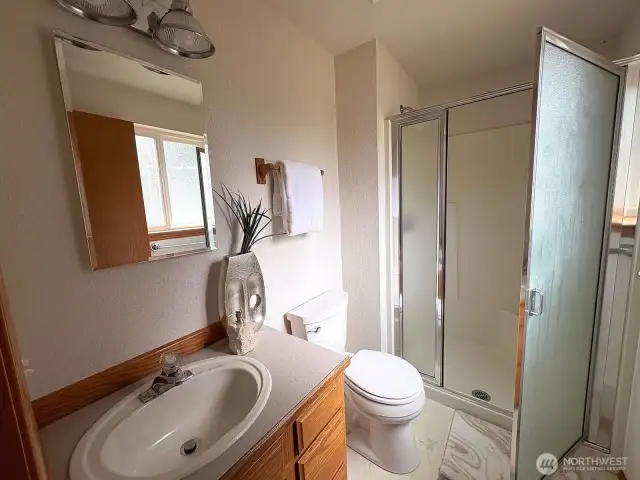 Primary suite features its own ¾ bath—bright and practical for everyday living.