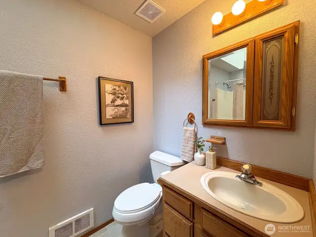 Bright full bath with skylight—ideal for both guests and everyday use.