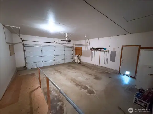 Ample garage space with storage and ramp access—practical and functional.