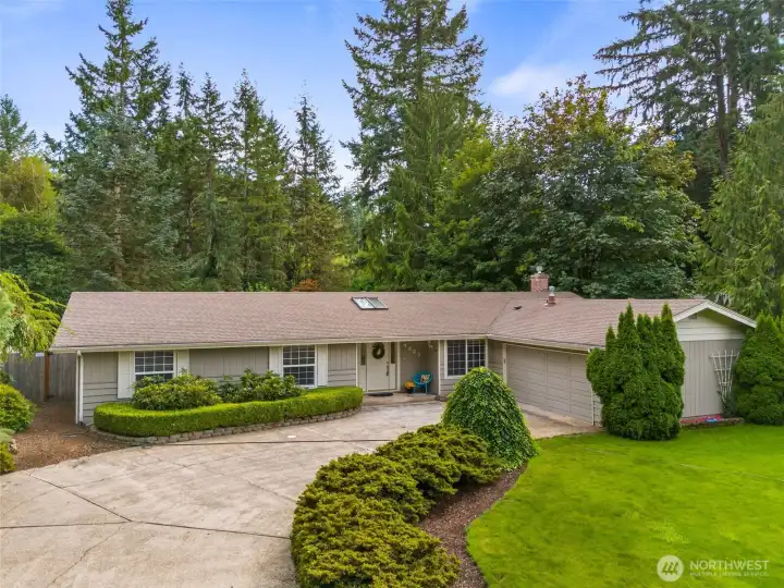 Well cared for rambler on 1/3 acre.  Stunning landscaping with large yard offering privacy + lake access