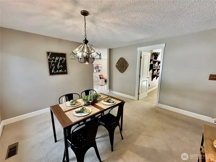 Dining room, door to family room straight ahead. New white trim and doors throughout home.