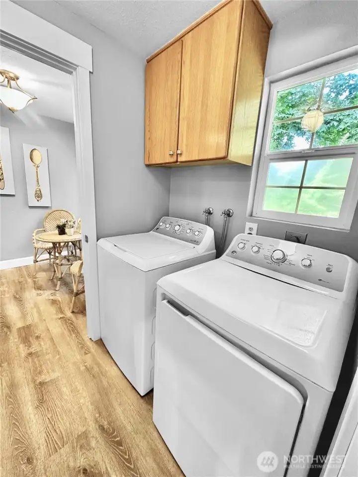 Laundry room with cabinets is just off kitchen. Washer and Dryer included!