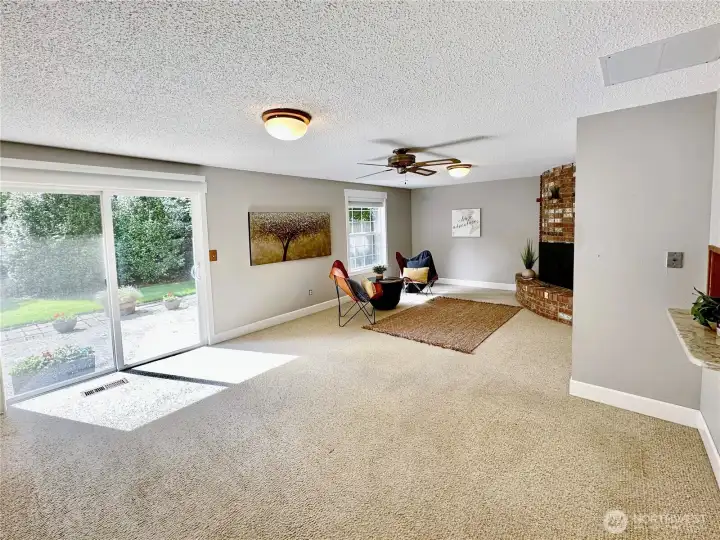 Slider off family room offers access to patio and lovely rear yard.