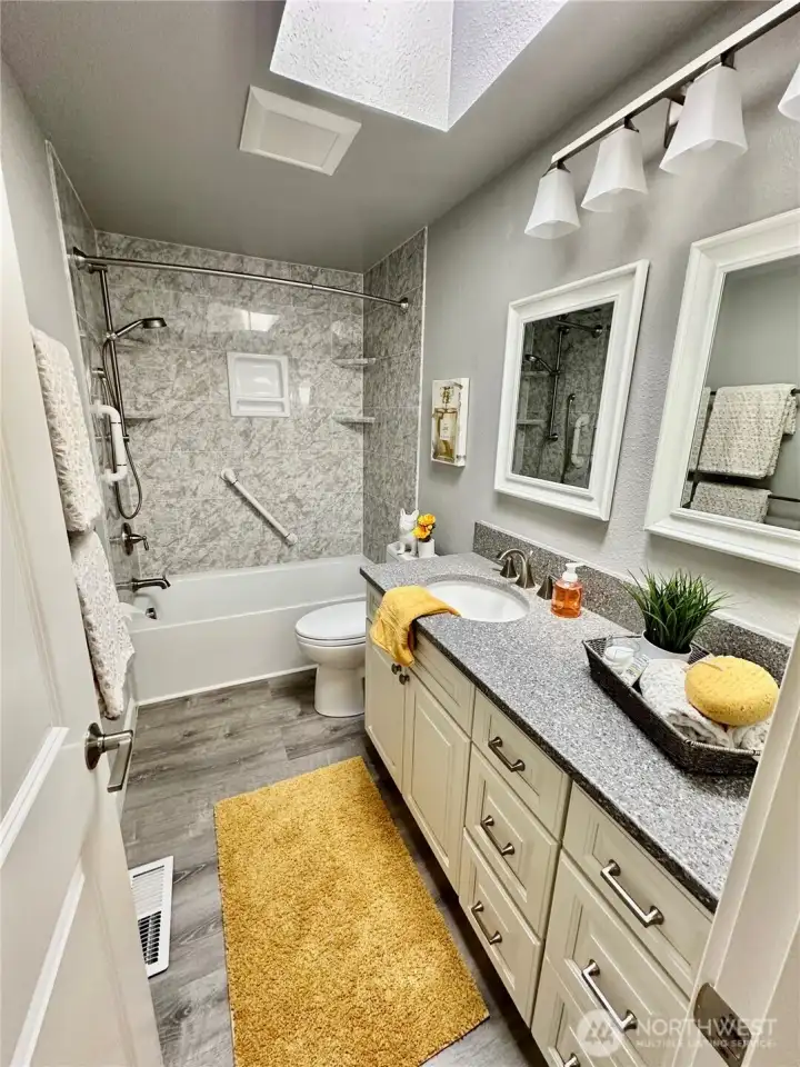 Updated hall bath with skylight.