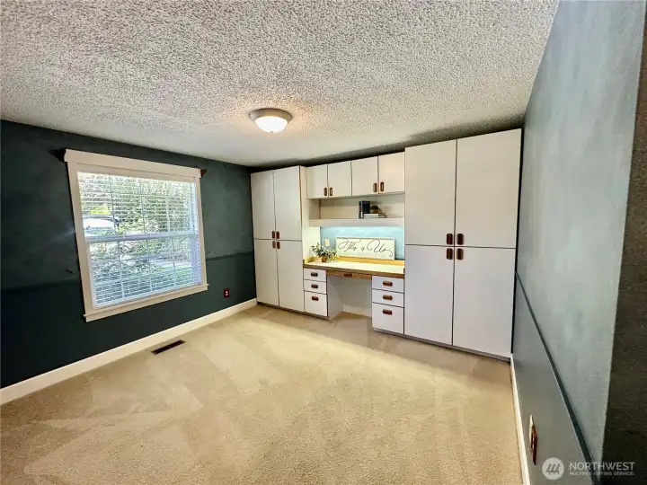 Generous 3rd bedroom features built-in desk and storage.