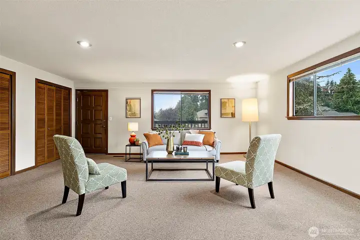 Comfortable sitting room on main level past the kitchen and dining areas.