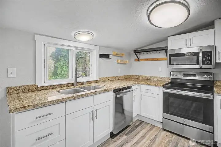 The kitchen view into a ravine full of vegetation gives you the peace and quiet you will always have with this property