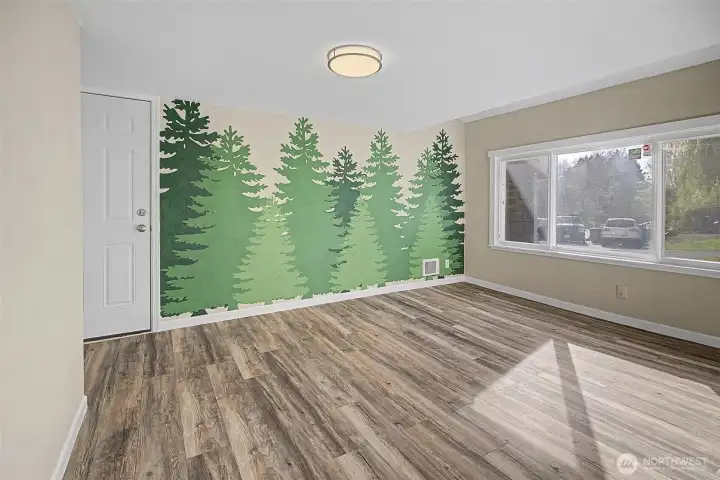 Main floor bedroom with huge front window