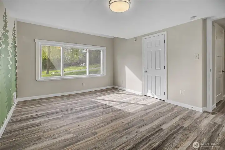 Tons of natural light and behind that door is a walk in closet for all your treasures