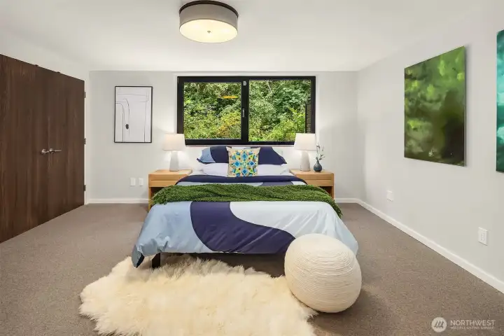 One of two bedrooms downstairs.  Custom California closets behind the closet doors