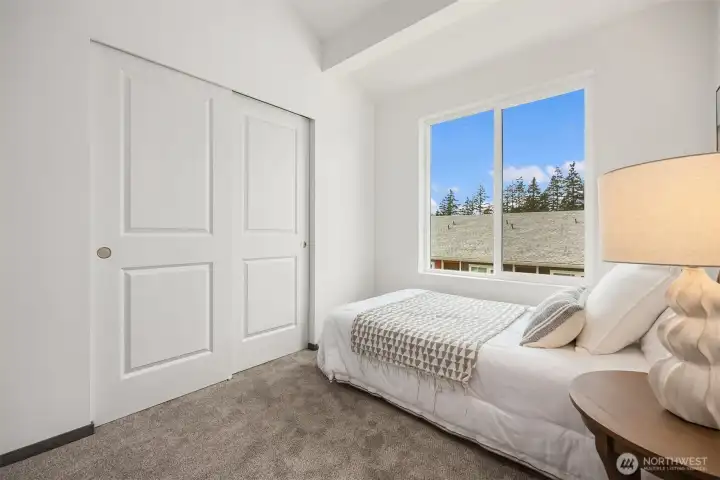 Thoughtfully designed secondary bedroom offering both comfort and utility.