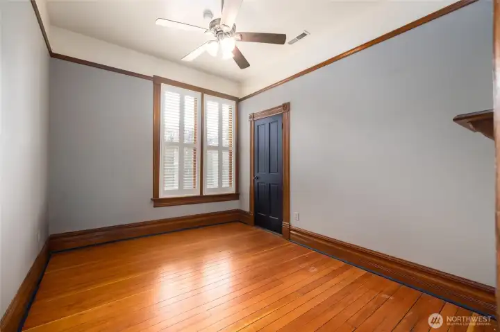 Gleaming wood floors in upstairs bedroom.
