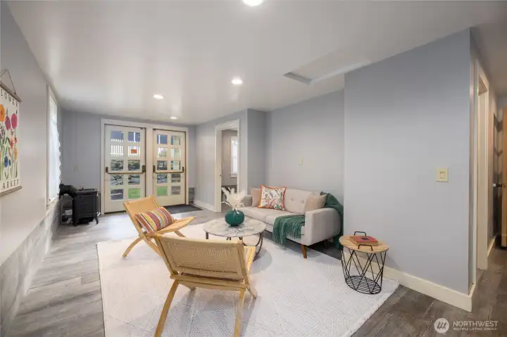 Back entry room, cozy lower-level lounge/bonus room with garden access.