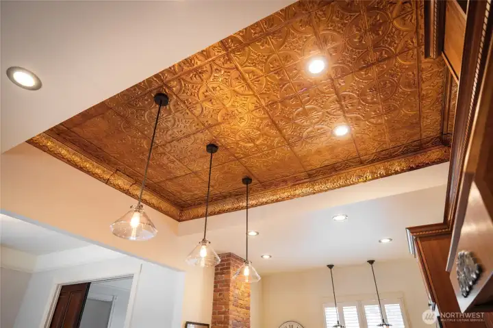 Pressed-tin kitchen ceiling in a burnished copper.