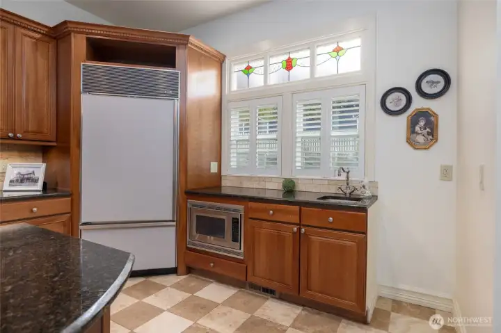 Spacious kitchen, large refrigerator, extra sink, and built in microwave.