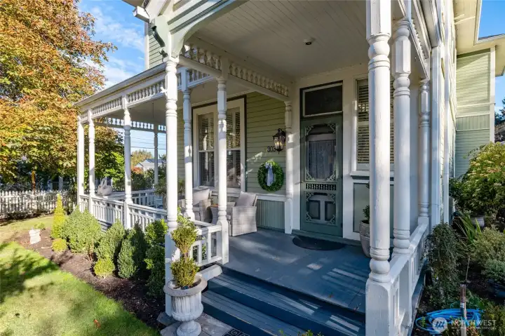 Wrap around front porch with classic Victorian details.