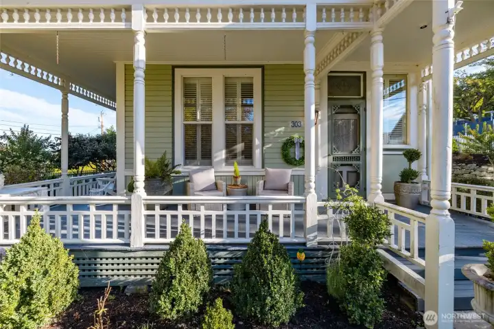 Wrap around front porch with classic Victorian details.