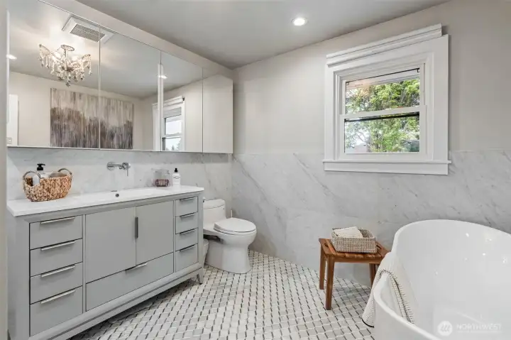 Main bathroom with deep soaking tub & heated floors