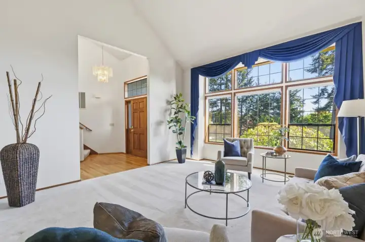 Greeted by vaulted ceilings and a bright, sun-filled room, the home feels instantly spacious.