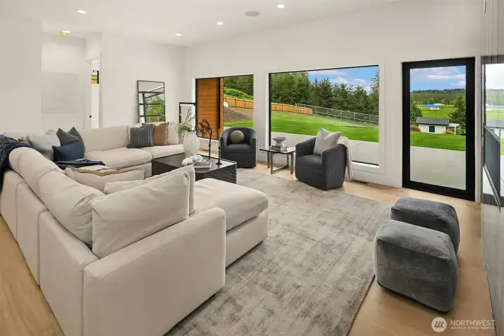 Relax in the large living room with stunning valley views and convenient patio access.