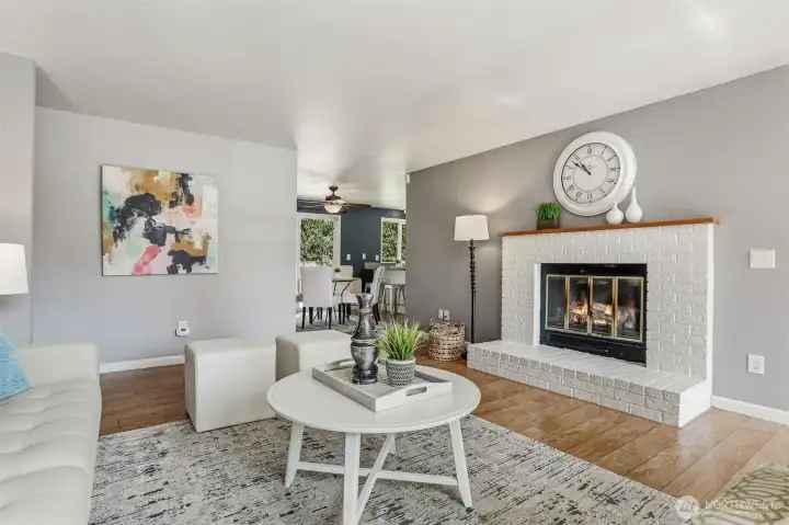 The front living room has a wood burning fireplace with a blower.