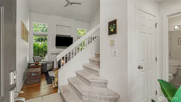 Enter into a light and bright foyer with vaulted living space