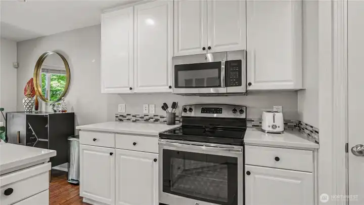 Plenty of storage in this functional kitchen overlooking dining & living areas.