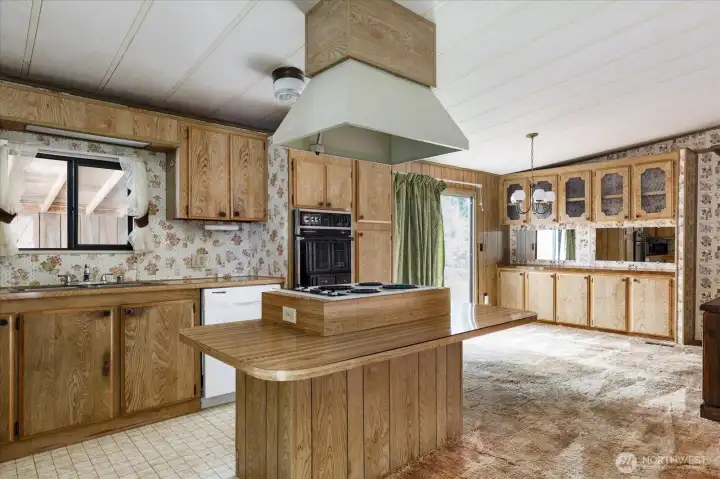 Open-concept kitchen seamlessly connected to the living and dining area.