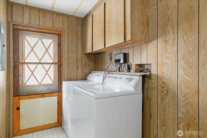 Spacious utility room with convenient exterior access.