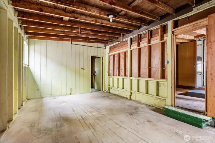 Garage offers a dedicated extra storage space at the far end.