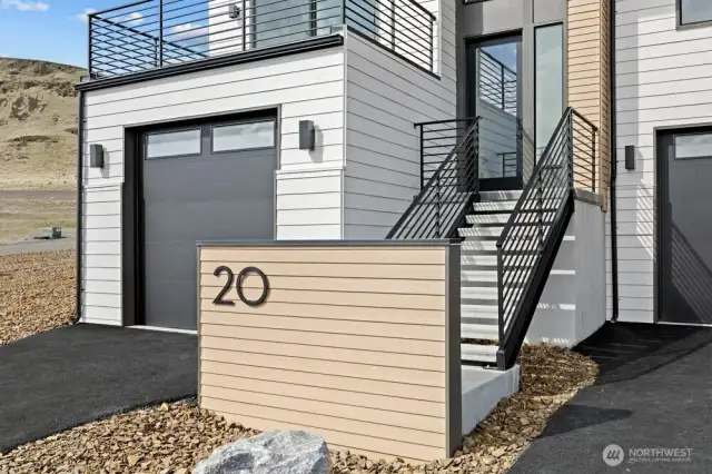 Gorgeous townhomes featuring expansive windows, ample parking, and multiple outdoor decks.