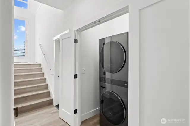 Laundry closet conveniently located for easy everyday living.