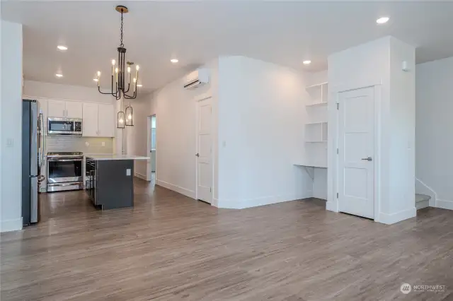 Attractive Luxury Vinyl Plank flooring, abundant recessed lighting & modern fixtures are found throughout the Main Floor. The Smart Home Center to the left of the stairway features built-in shelves & a data port. The Smart Home tablet serves as the home base for the Home Automation Suite. (video doorbells, lighting, thermostats, door locks & voice control functionality).