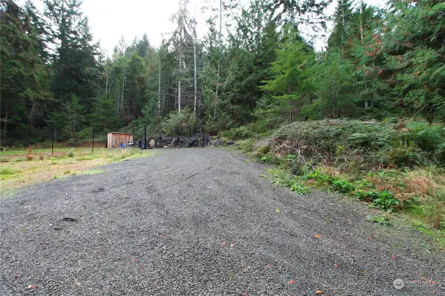 Outbuilding in fenced area. Would make a great dog kennel..